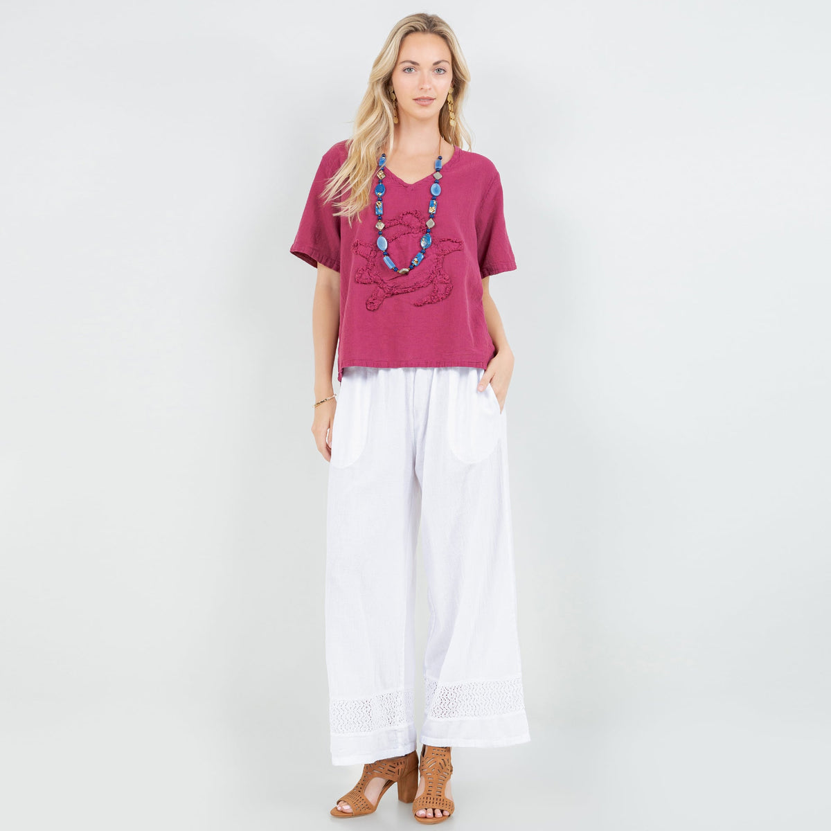 White cotton gauze wide-leg pants with elastic waist and lace-trim hem