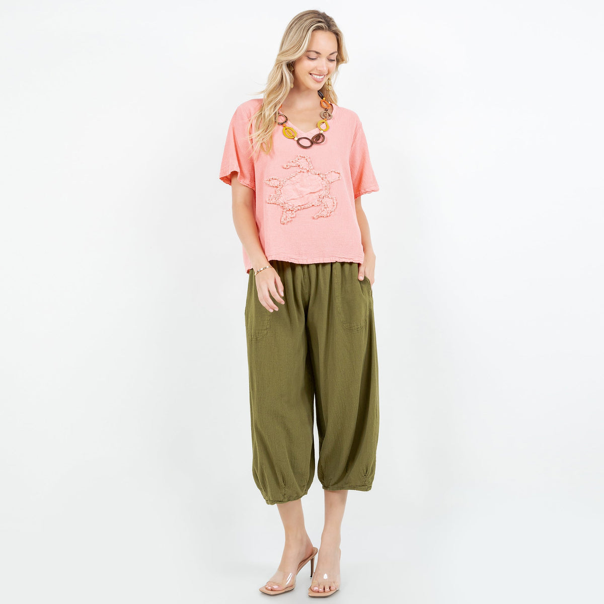 Women’s pink cotton gauze top with embroidered applique, V-neck and short sleeves