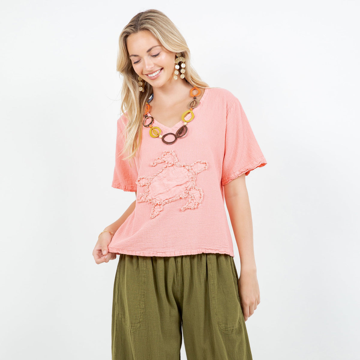 Women’s pink cotton gauze V-neck top with embroidered applique, short sleeves