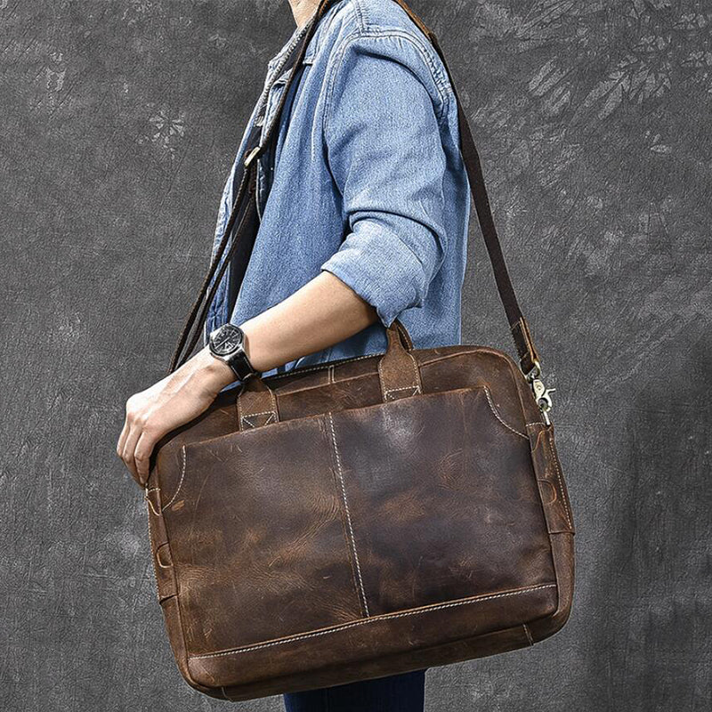 Vintage brown leather laptop briefcase with stitched panels and top carry handles