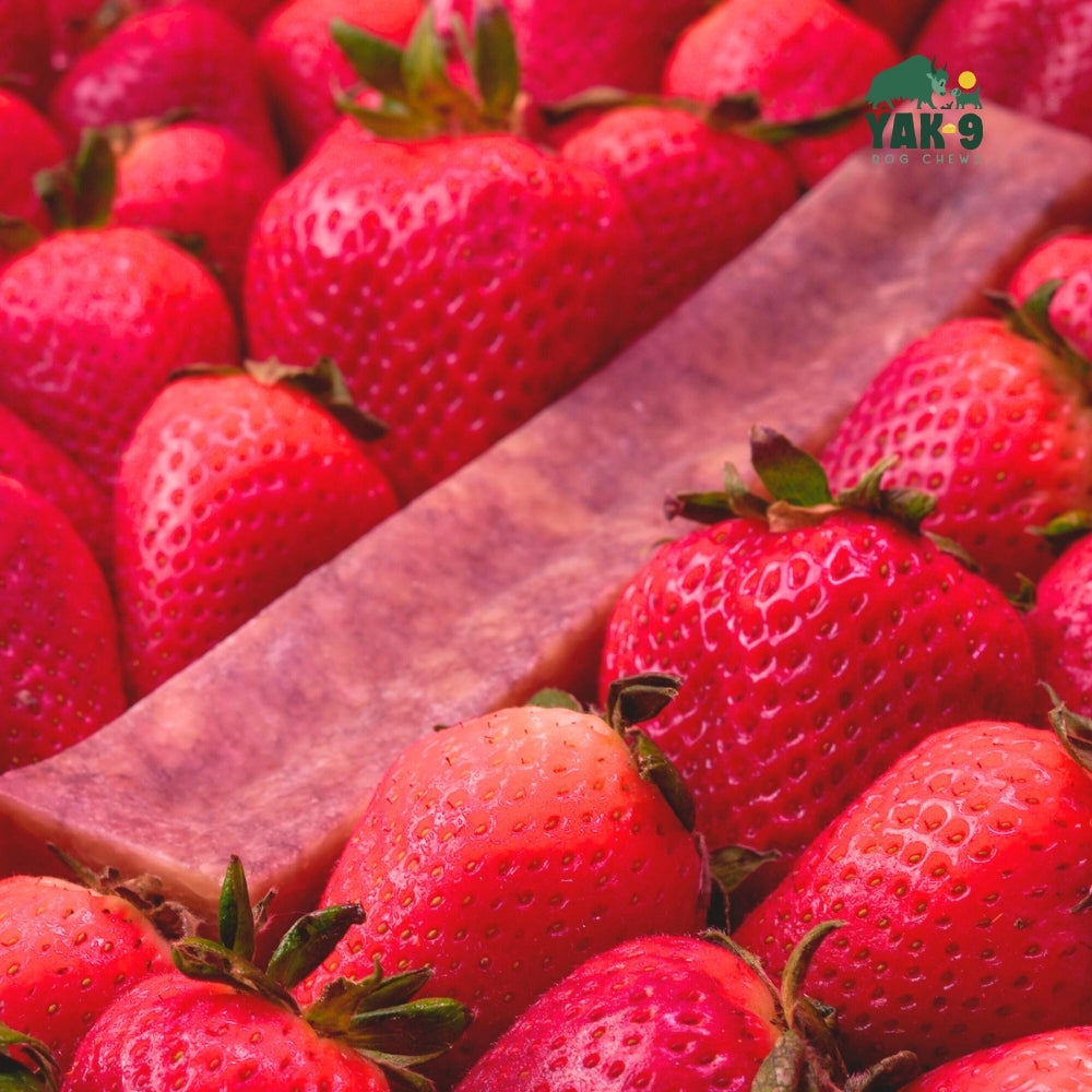 Close-up of strawberries beside a wooden cheese slab for strawberry cheese chews