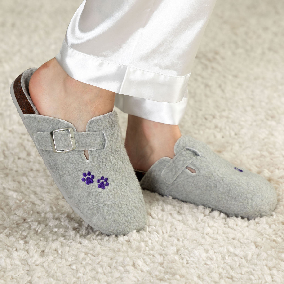 Gray plush sherpa clog slippers with paw print patch and adjustable buckle straps