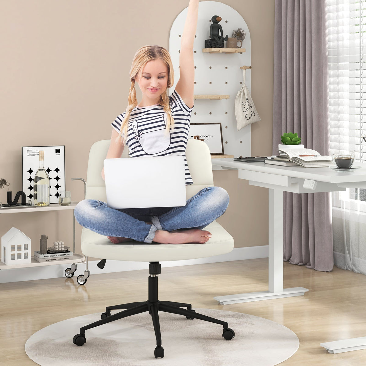 Armless desk chair with beige upholstered seat and back, black caster base