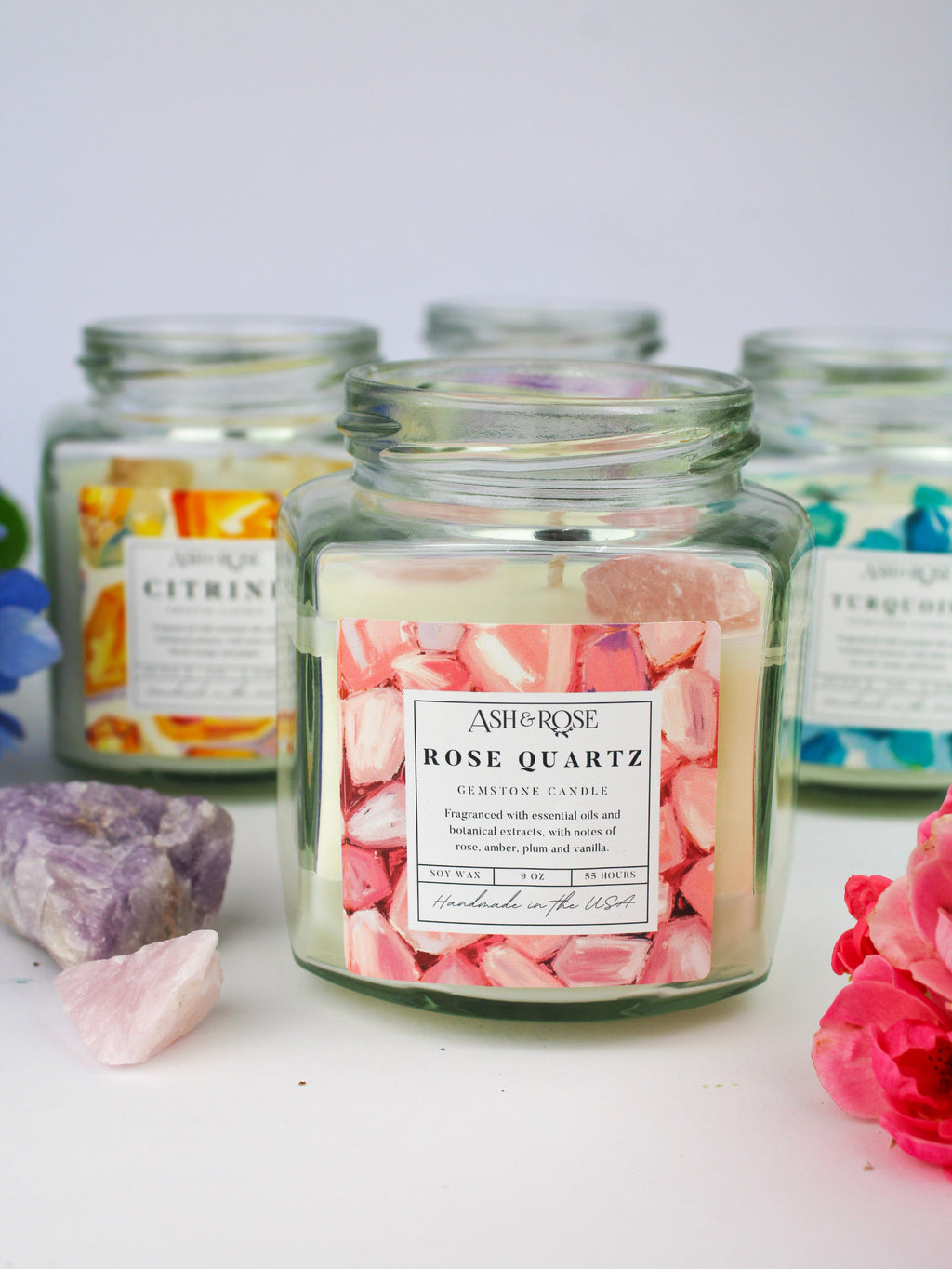 Rose Quartz gemstone candle in clear round glass jar with pink crystal fragments