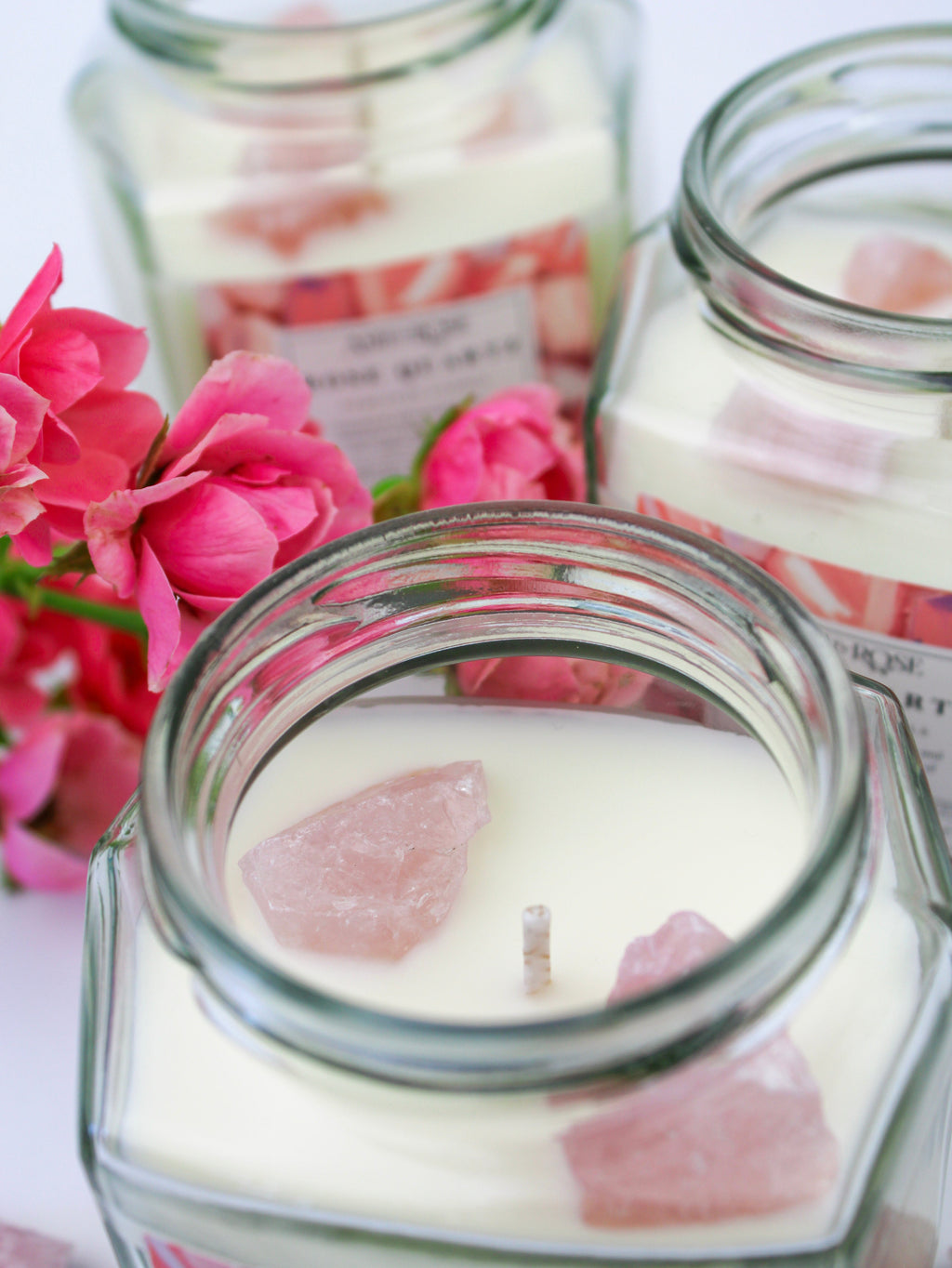 Crystal candle jar with rose quartz crystal wax pieces, clear glass lid