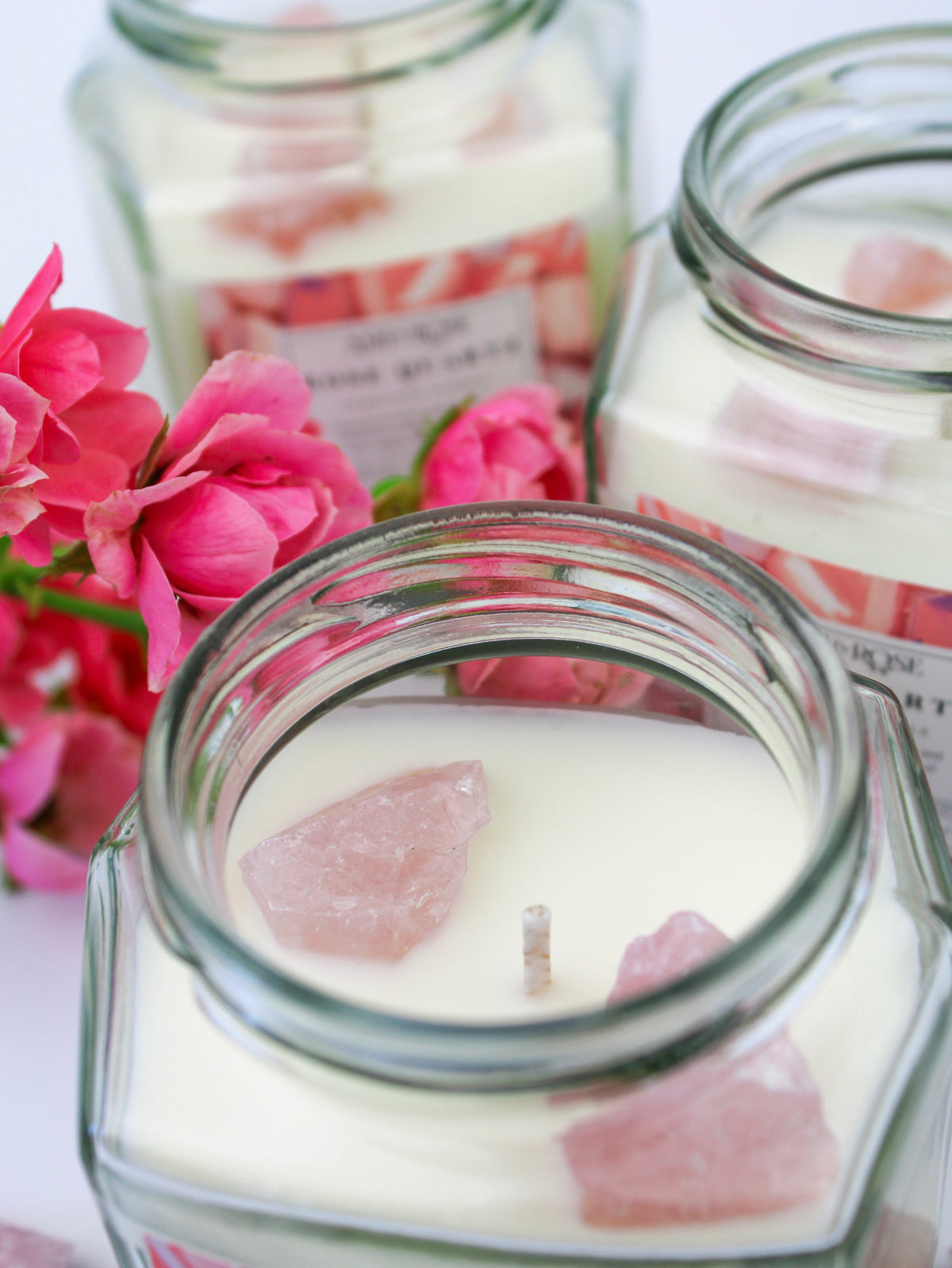 Crystal candle jar with rose quartz crystal wax pieces, clear glass lid