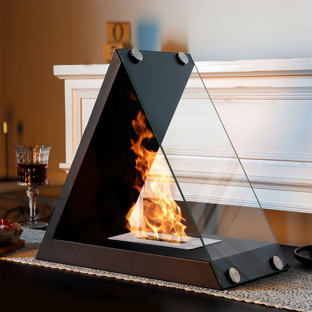 Black triangular tabletop alcohol fireplace with rising flame and glass viewing panel