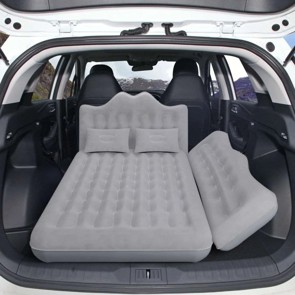 Gray SUV rear-seat air mattress with two pillows and inflatable mattress panels