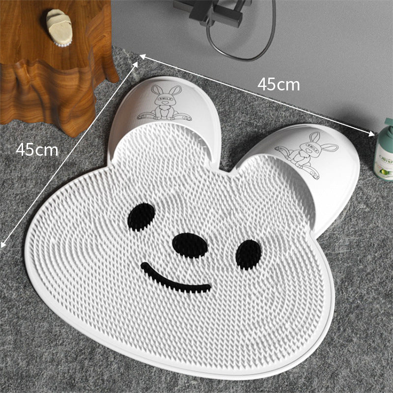 White silicone rabbit foot massage mat with raised texture and cartoon face
