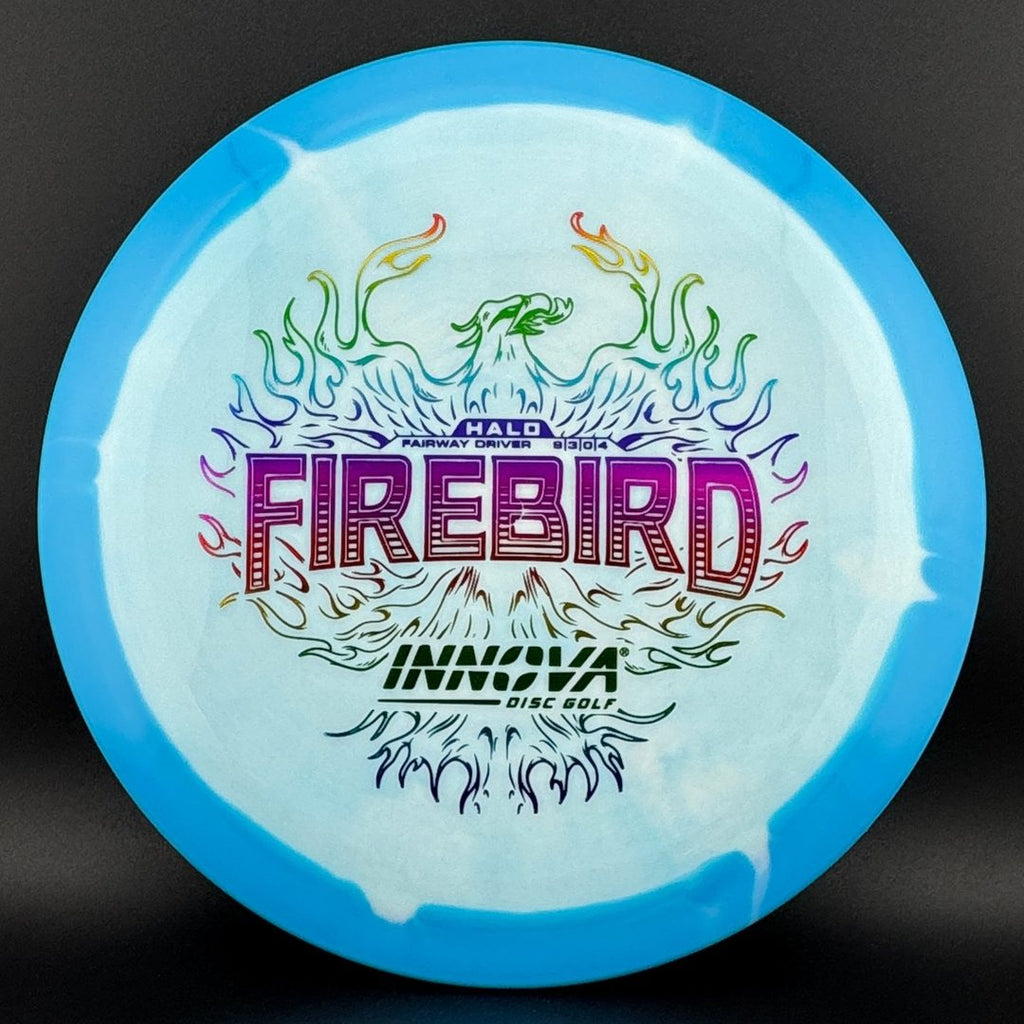 Light blue and clear disc golf disc top with colorful flame logo graphic