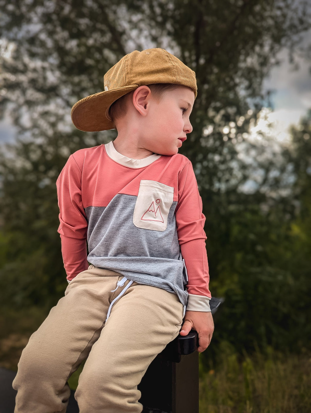 Kids pink and heather gray long-sleeve shirt with front pocket and off-white collar trim