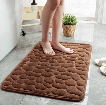 Brown bathroom bath mat with raised pebble-texture dots, non-slip backing
