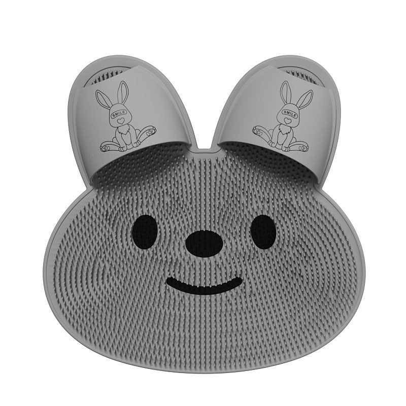 Gray silicone rabbit foot massage mat with cartoon face and paw print pads