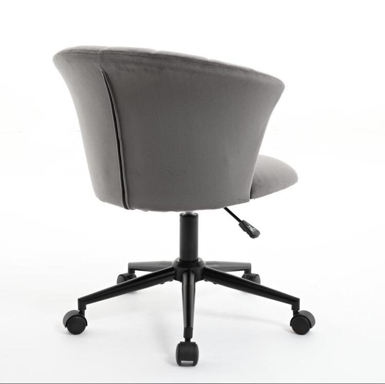 Grey velvet office chair with curved backrest and black base with casters