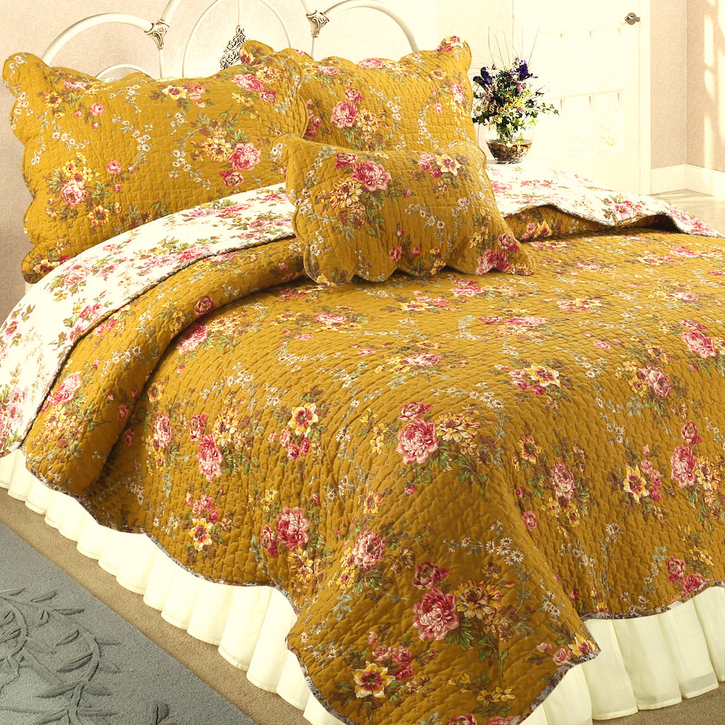 Mustard yellow floral reversible quilt set with pillow shams and scalloped edge trim