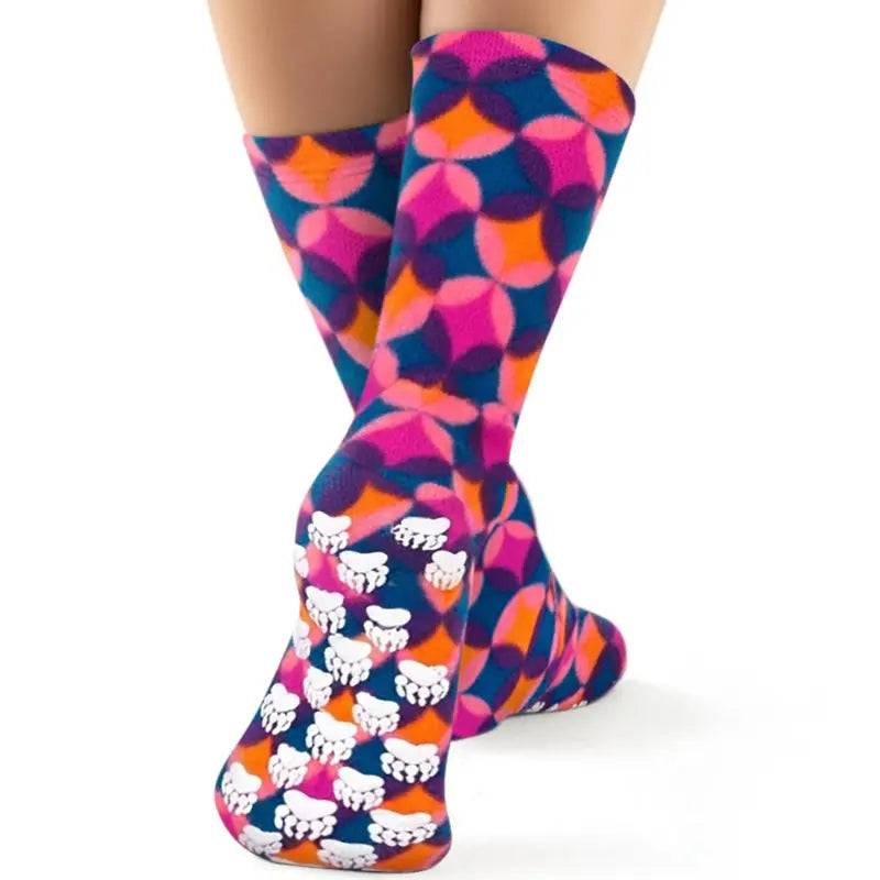 Kids' nonskid fleece socks with geometric print and white paw-grip on foot