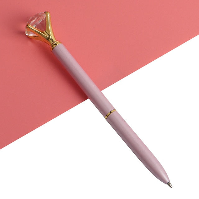 Kawaii ballpoint pen with pink barrel and gold gem-style cap