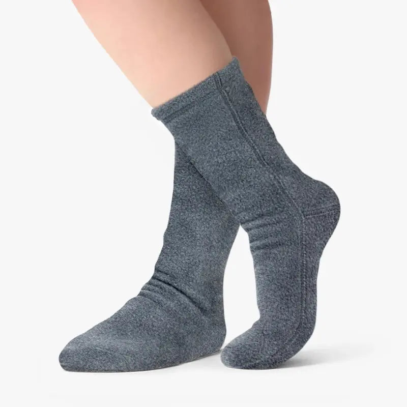 Soft grey fleece crew socks on legs, ribbed cuffs, snug fit