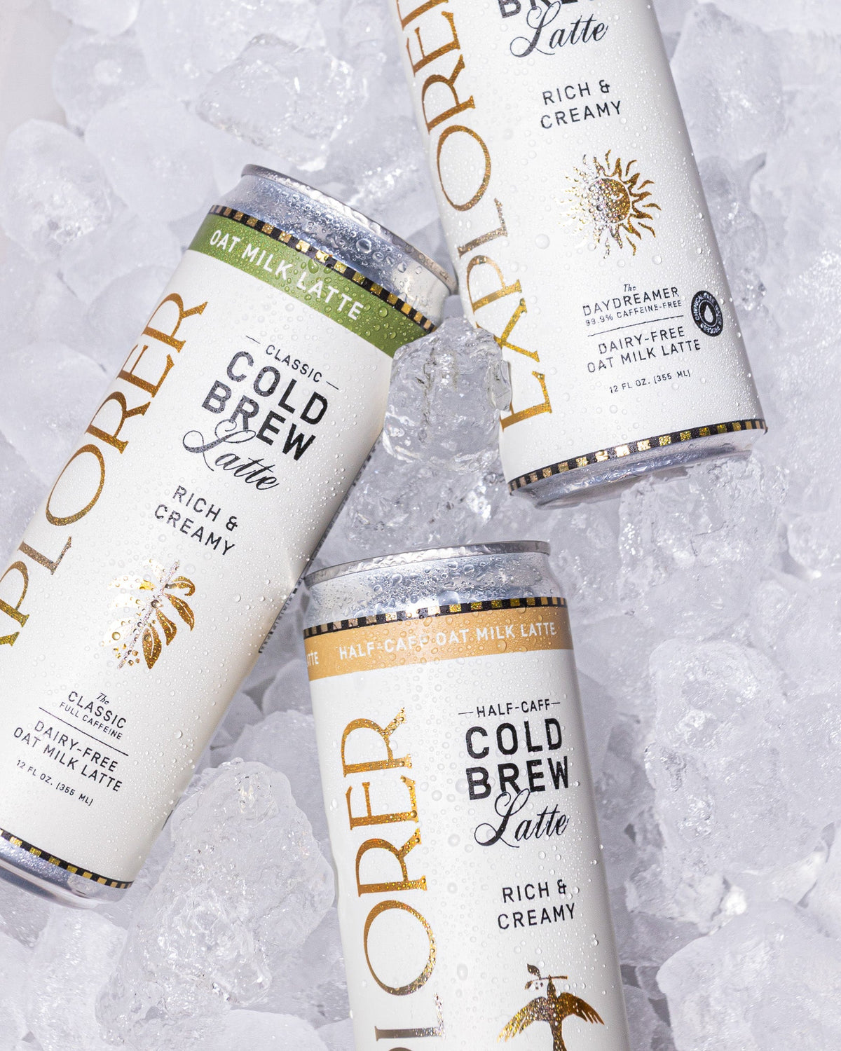 Cold Brew Oat Latte cans, rich and creamy, multiple can fronts with gold accents