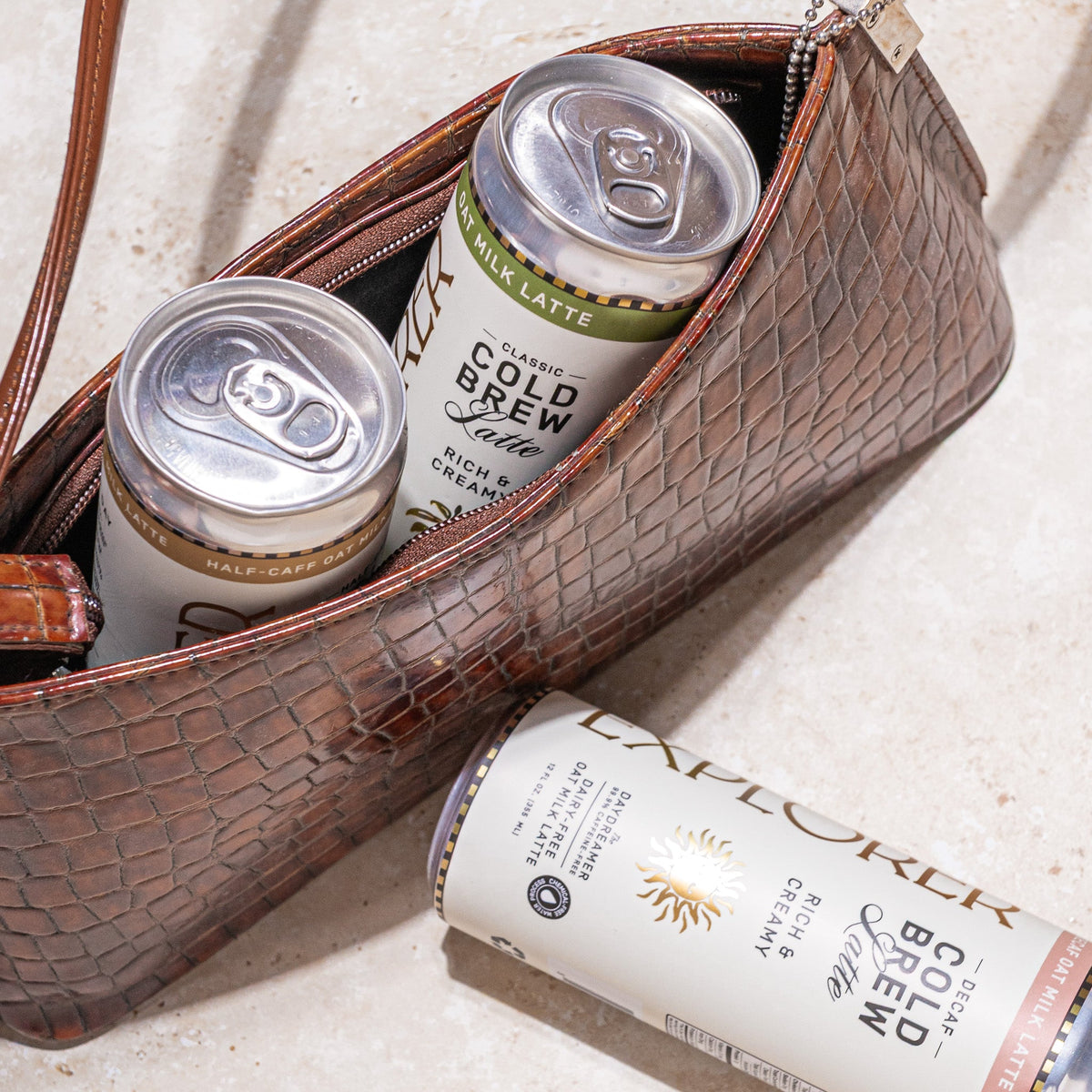 Cold Brew Oat Latte cans with pull-tab tops, rich and creamy label