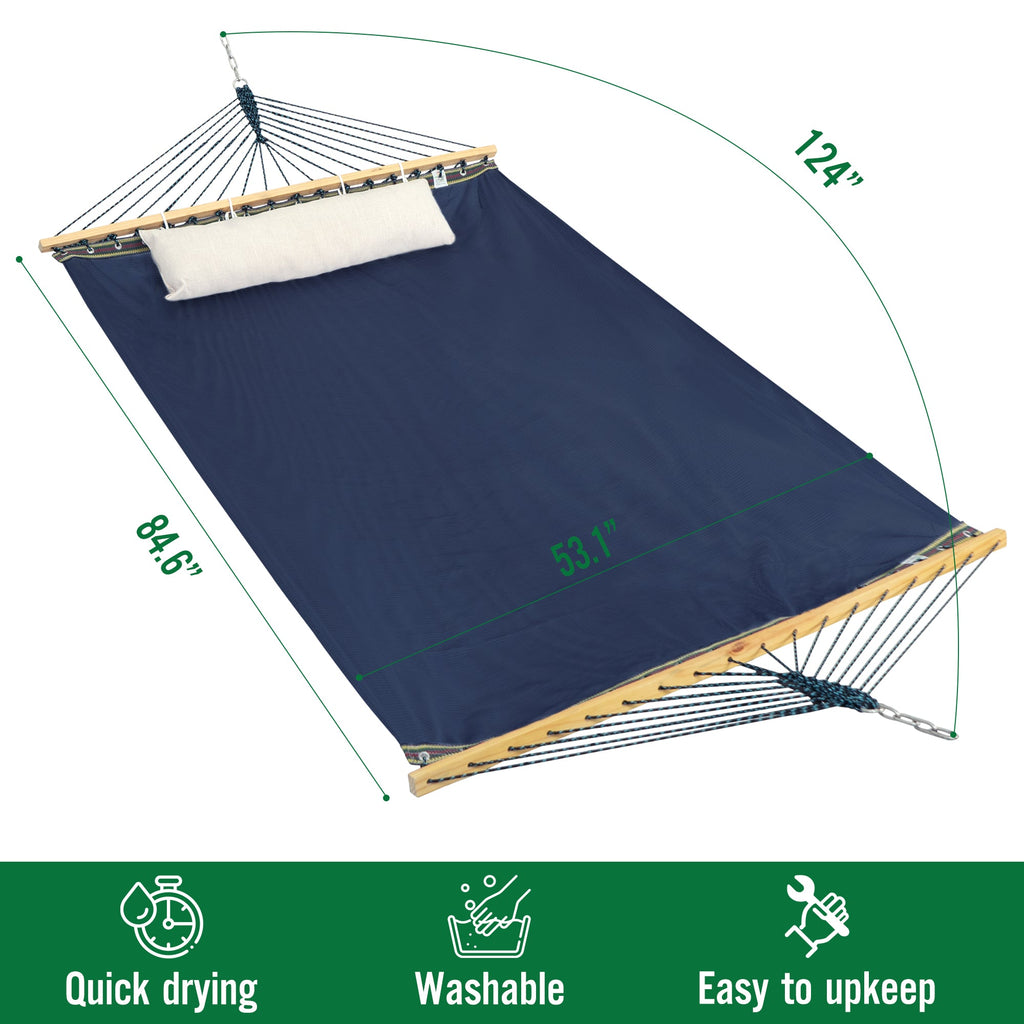Hammock with stand, navy canvas with off-white pillow, light wood spreader and rope net