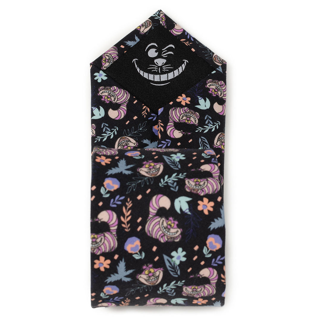 Folded black men's tie with Cheshire Cat face and colorful floral pattern