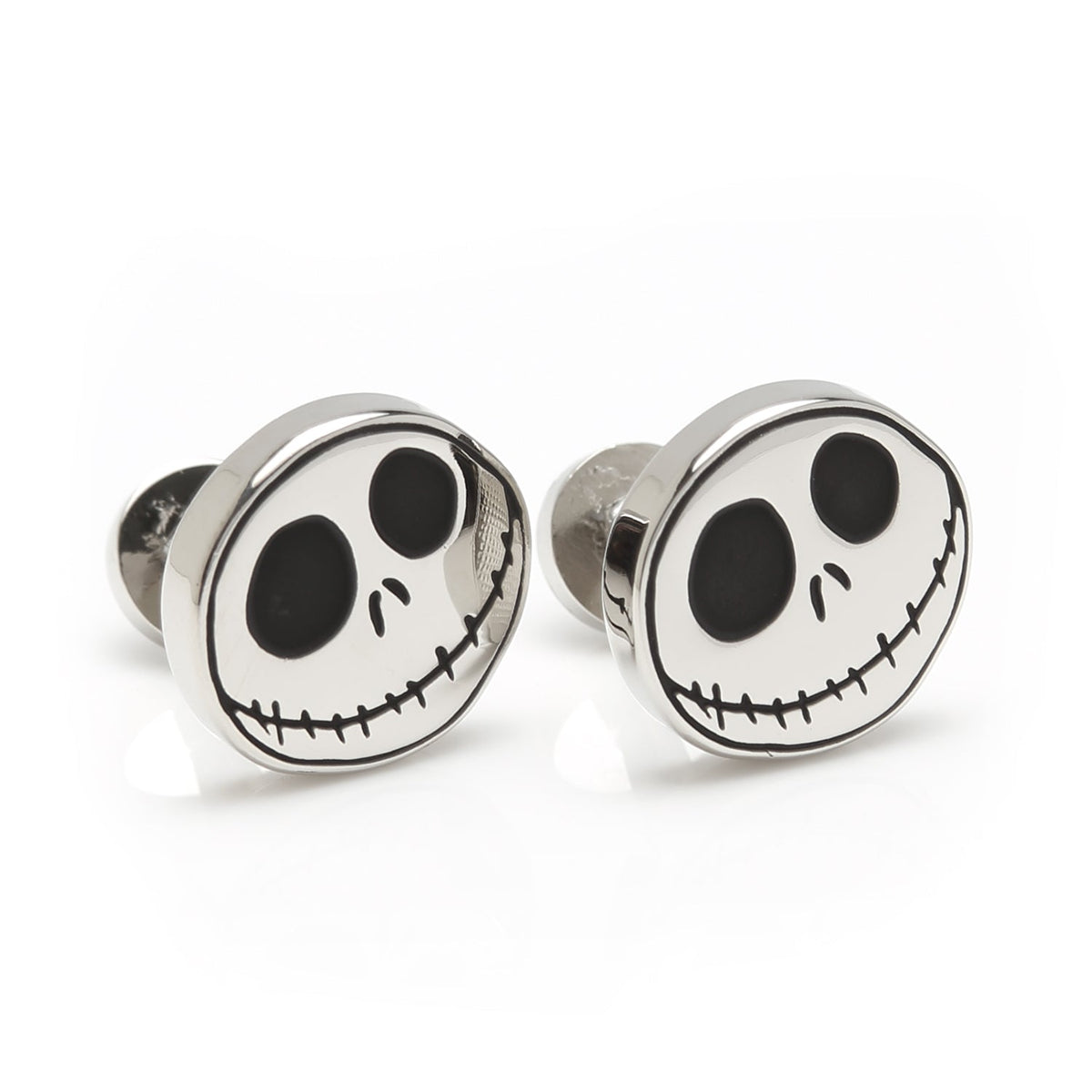 Pair of round silver cufflinks featuring Jack Skellington skull face emblems