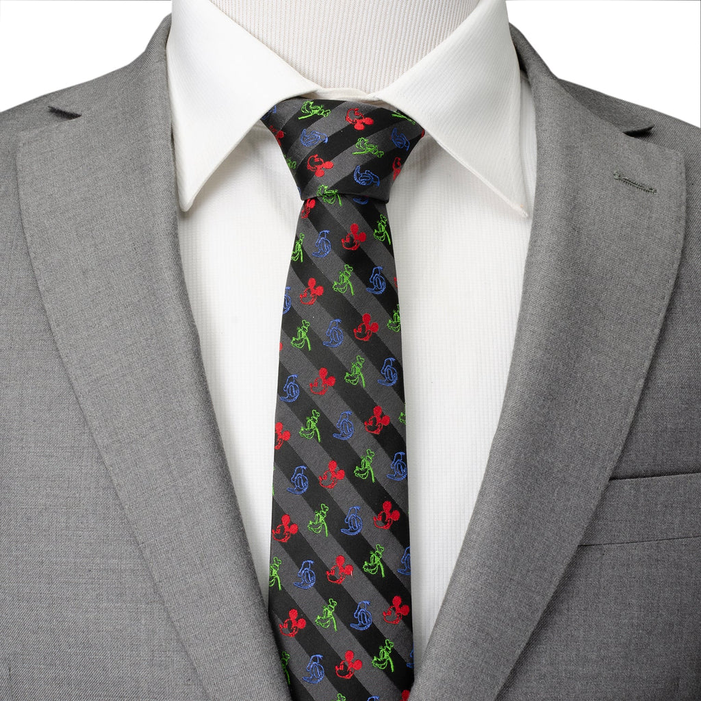 Character-print black tie worn with a gray suit jacket and white dress shirt