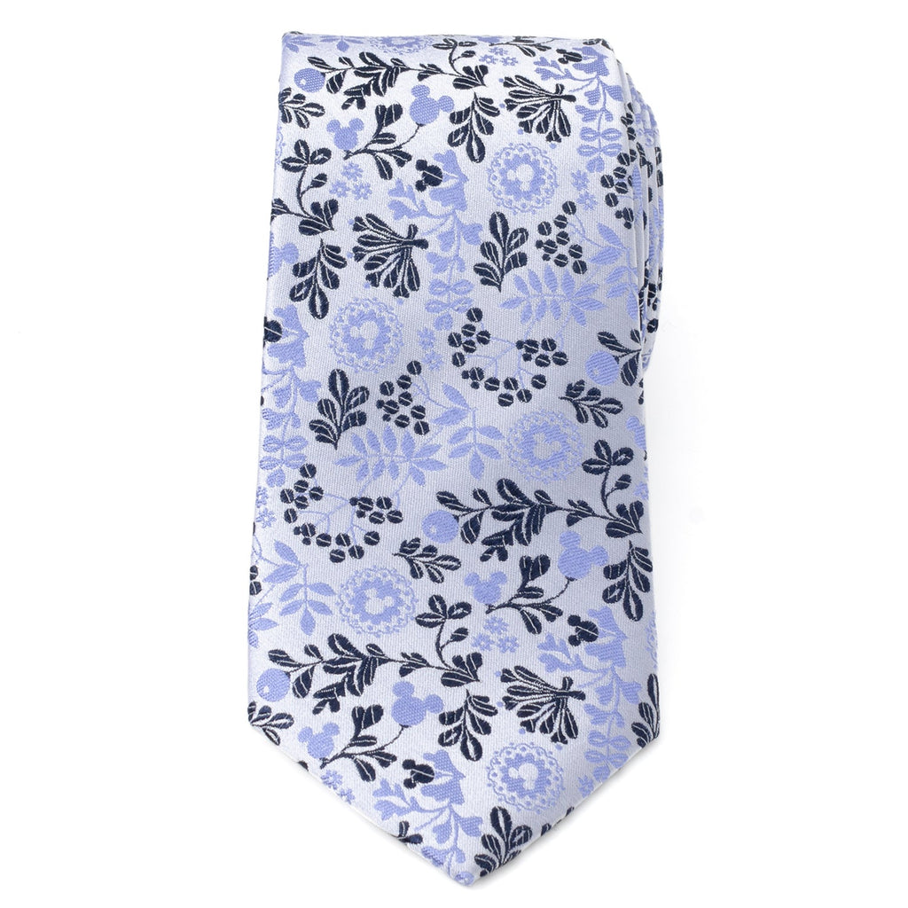 Blue and white floral necktie with dark leaf pattern, pointed end