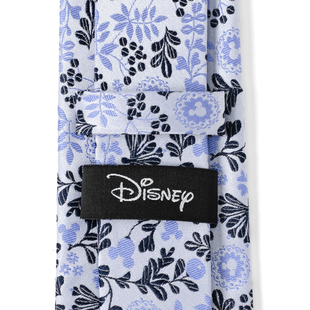 Blue and white floral necktie with black Disney logo label at center