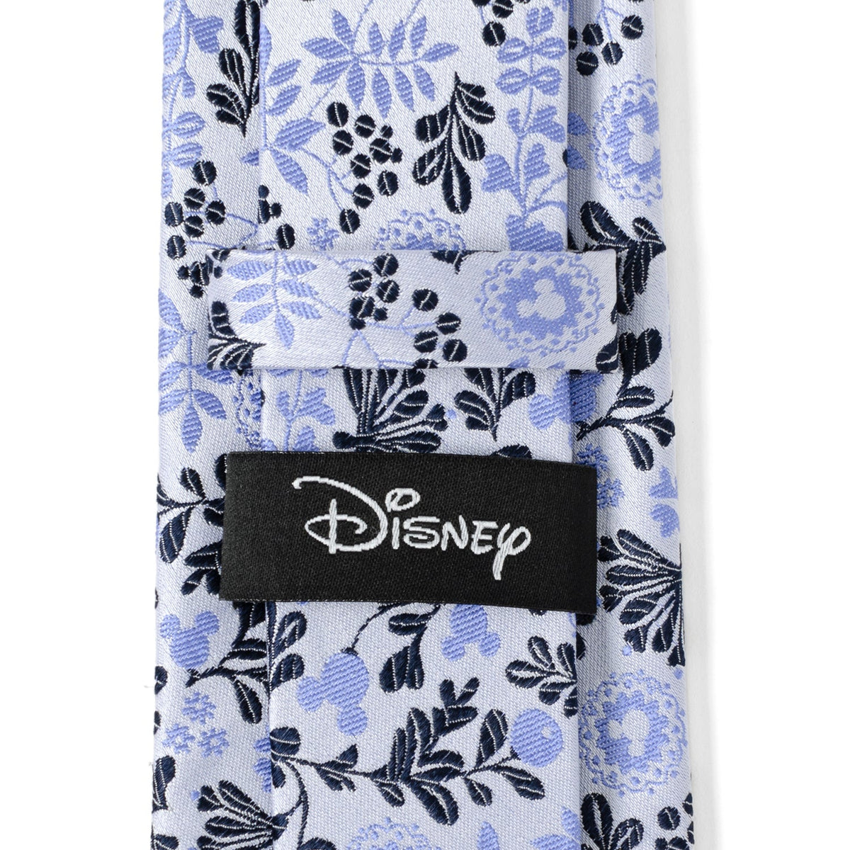 Blue and white floral necktie with black Disney logo label at center