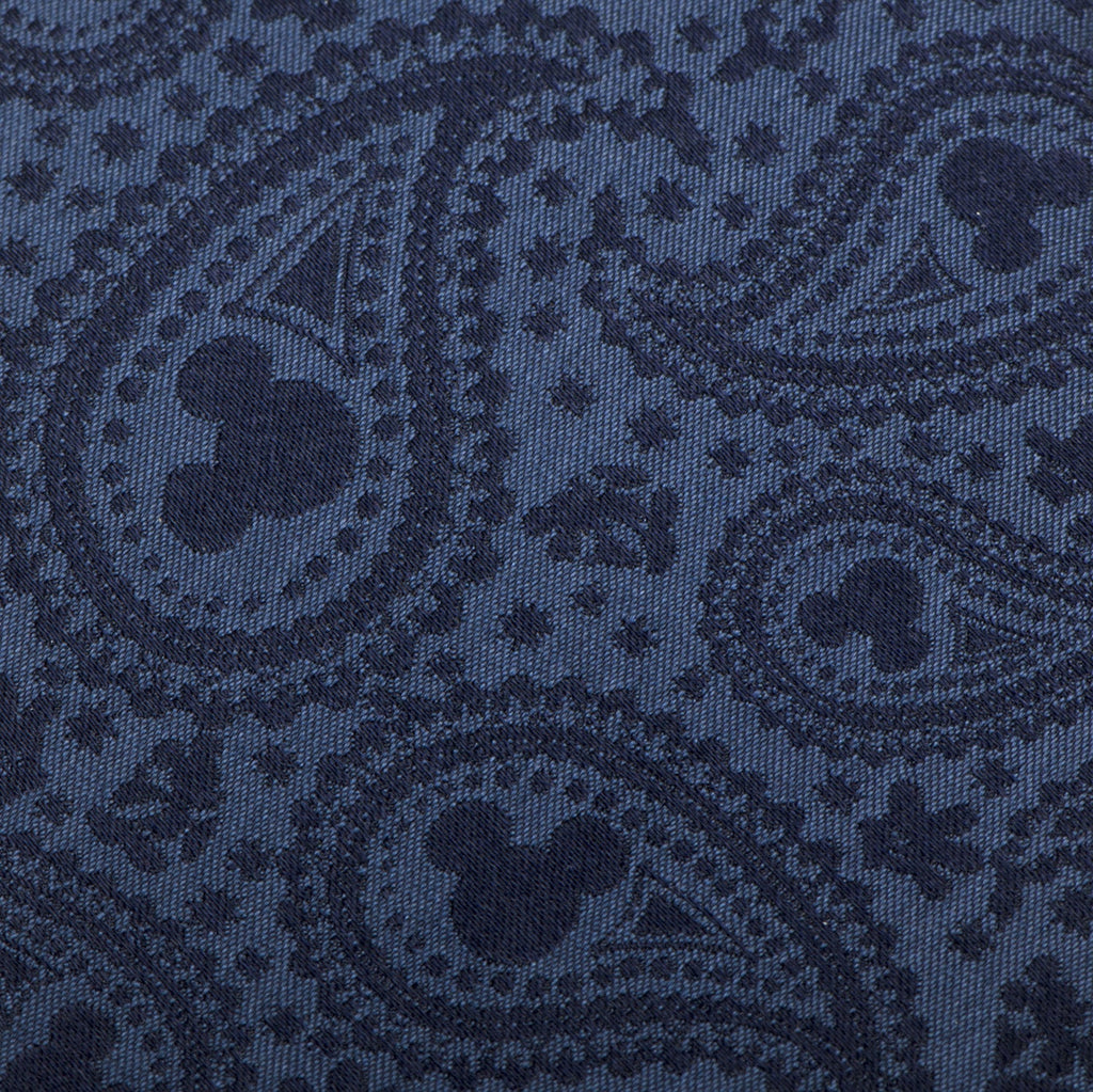 Close-up of navy Mickey Mouse paisley tie fabric with repeating icon print