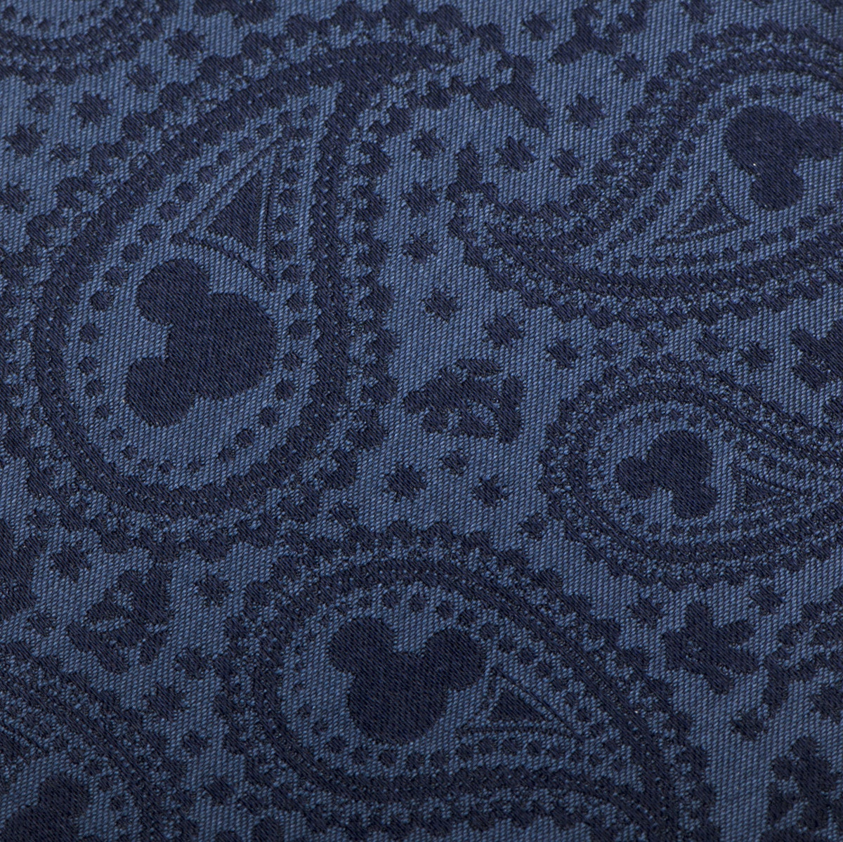 Close-up of navy Mickey Mouse paisley tie fabric with repeating icon print