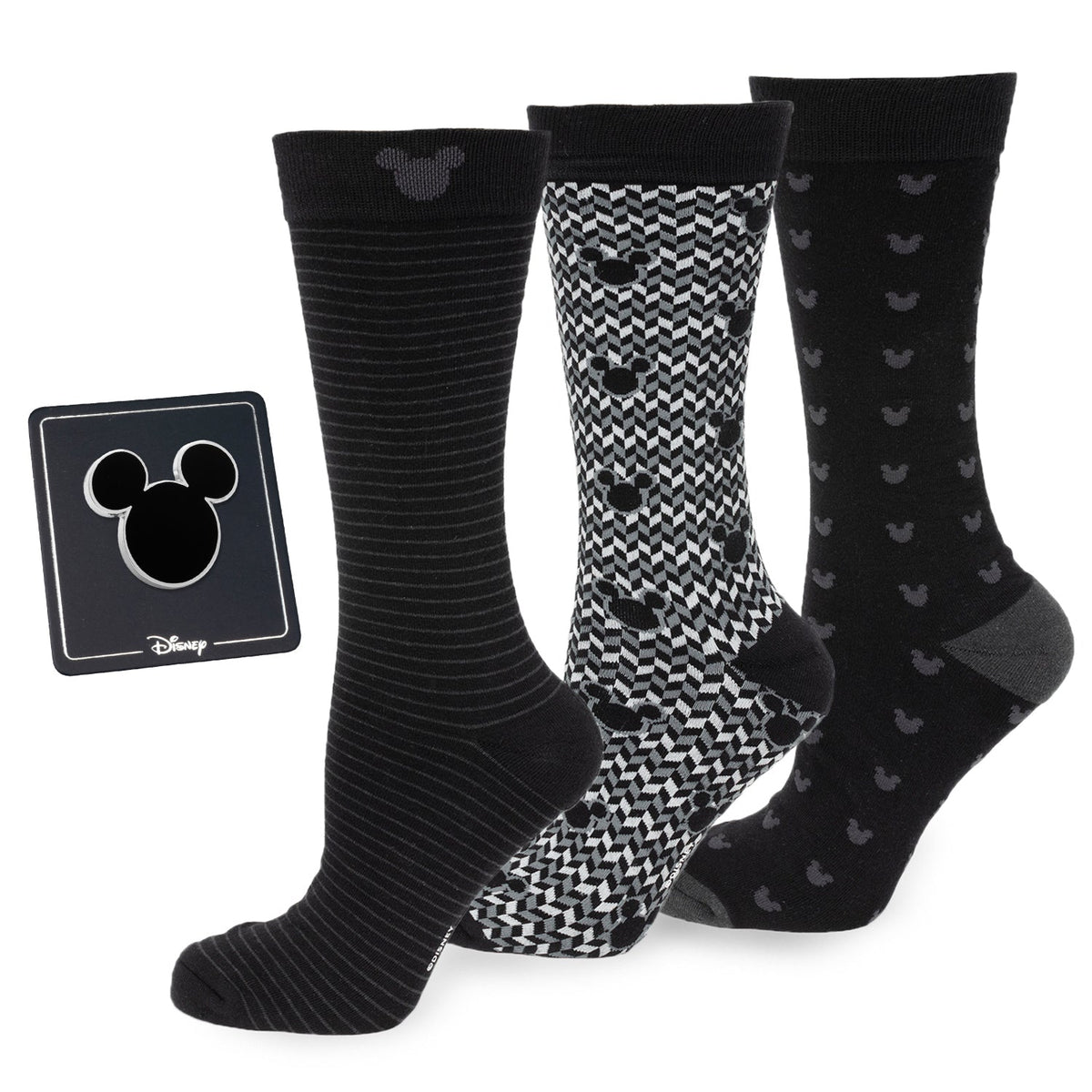 Three pairs of black Mickey-pattern socks: striped, checker, and dot designs