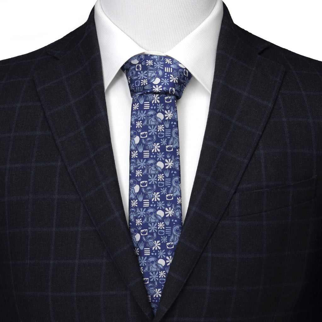 Men's blue tie patterned with Stitch faces, snowflakes, crowns and stripes