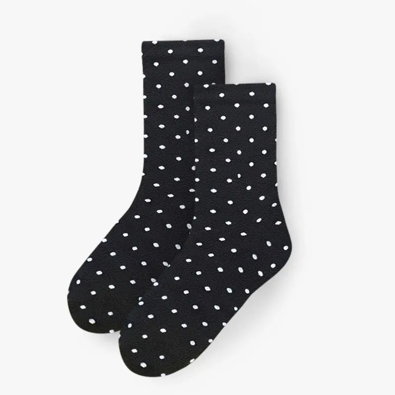 Pair of black crew fleece socks with scattered white dots