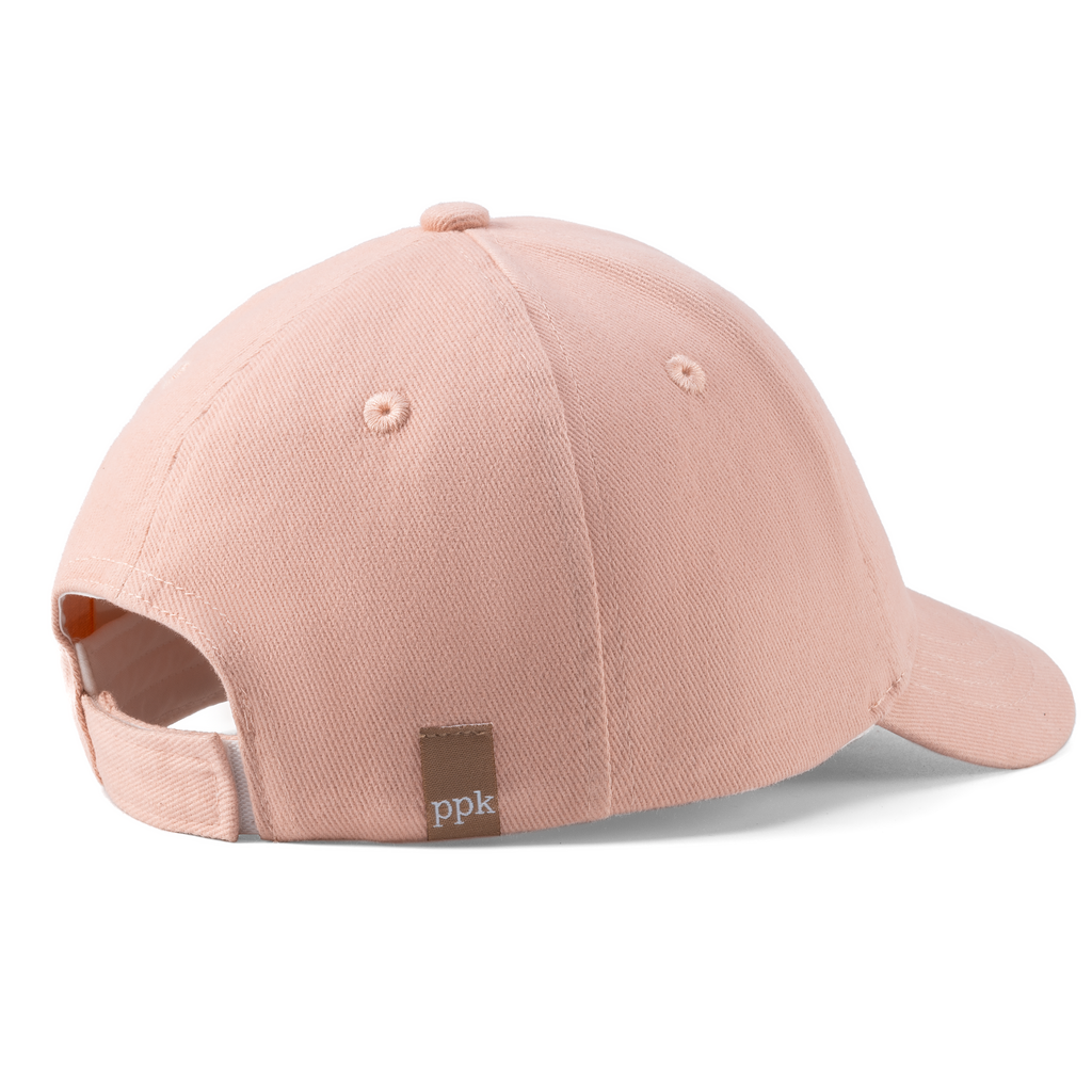 Pastel pink adjustable baseball cap with curved brim and stitched vent panels