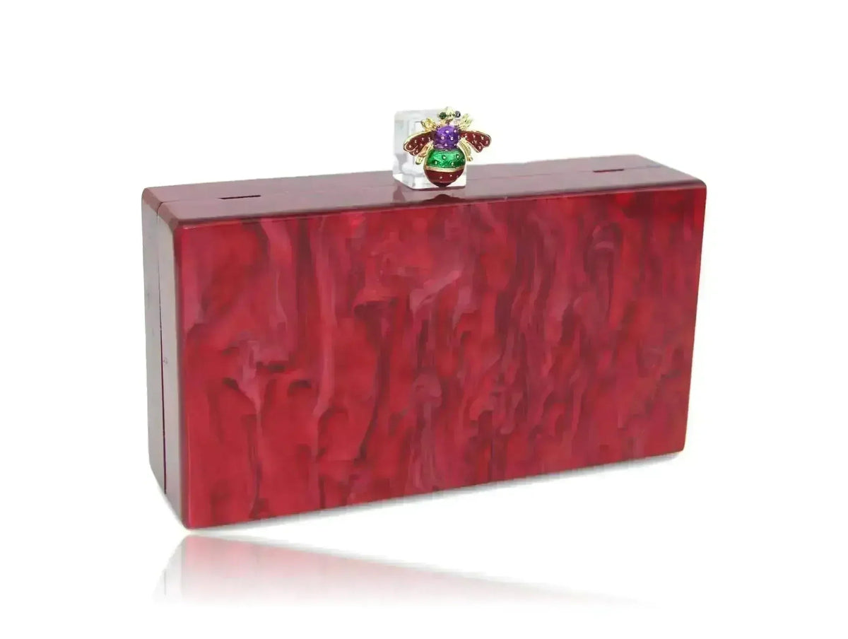Red acrylic box clutch angled view with jeweled bee top