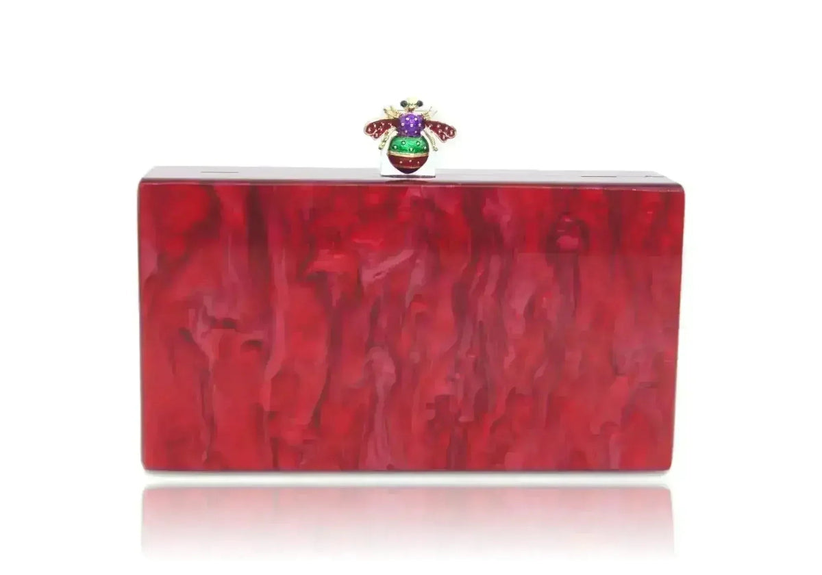 Red acrylic box clutch with jeweled bee and pearl clasp