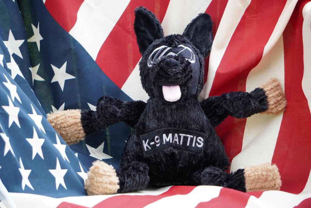 Plush black German shepherd dog toy with K-9 MATTIS shirt, tan paws, and pink tongue