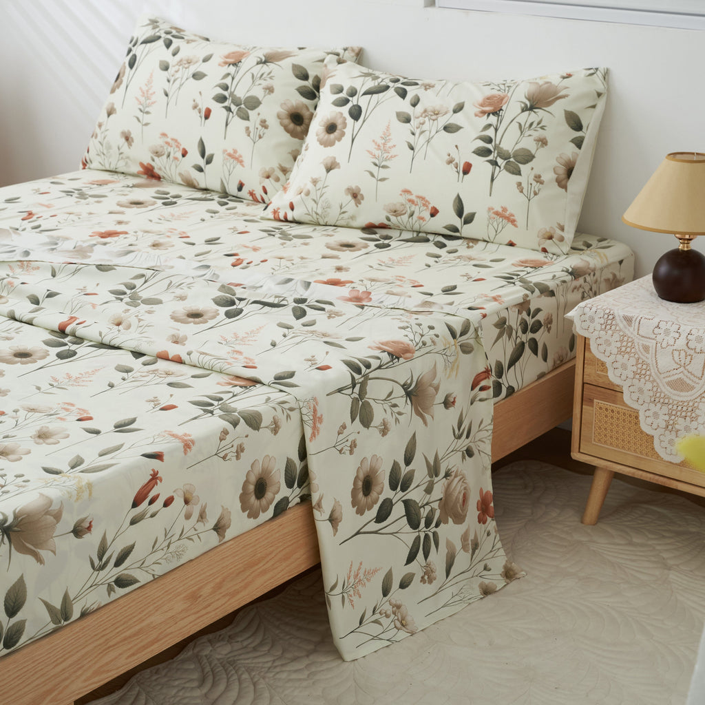 Floral microfiber sheet set featuring cream fabric with garden leaves and flowers; layered bed cover