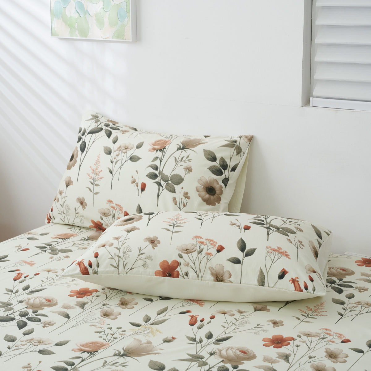 Floral microfiber sheet set on bed with two pillowcases, botanical garden print