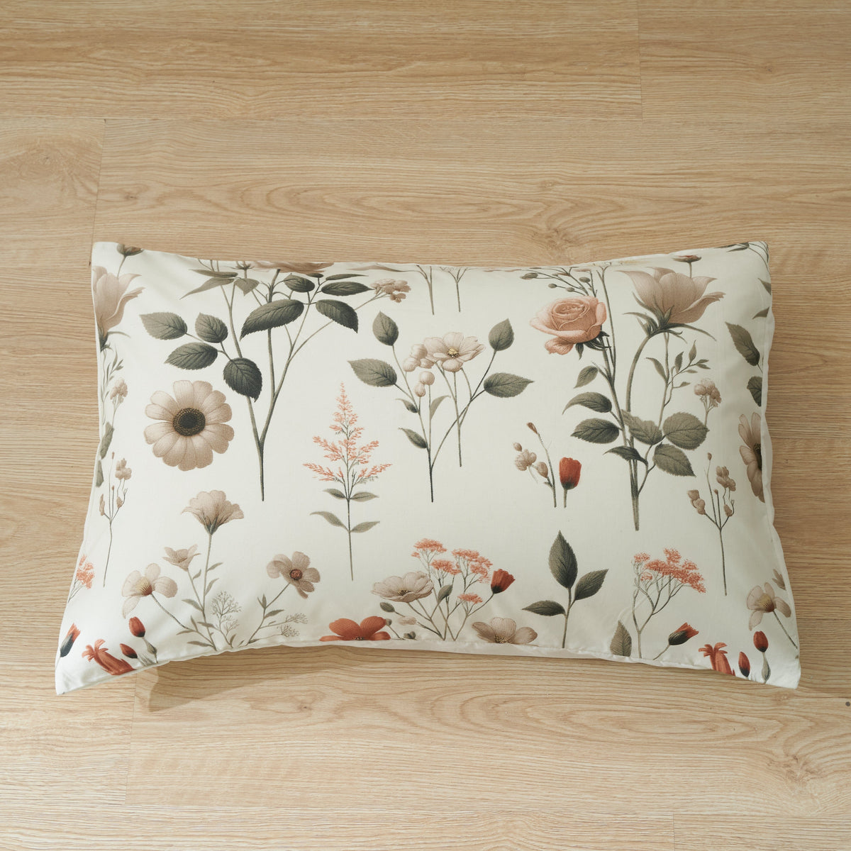 Pair of floral pillowcases in cream with meadow flowers and leaves print