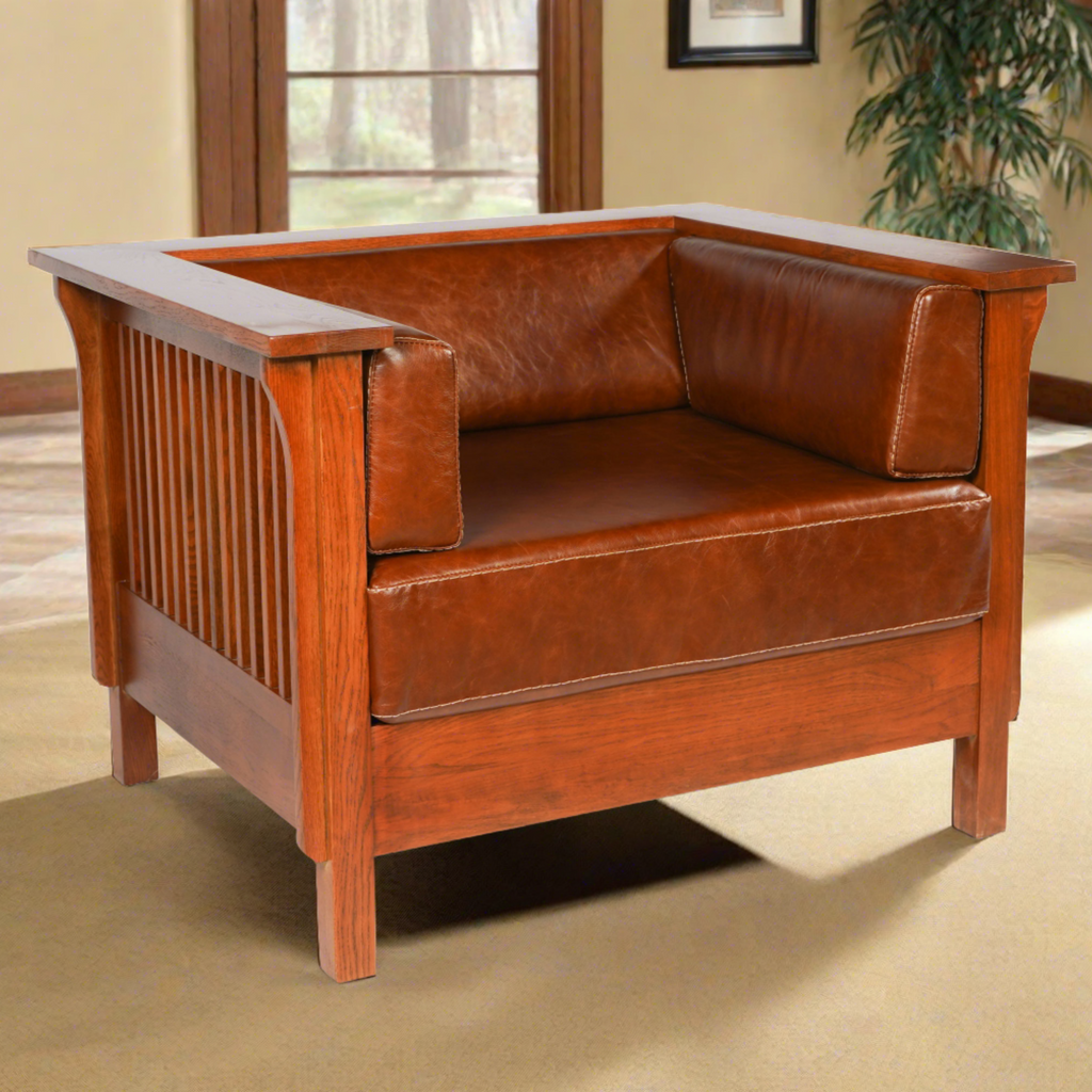 Brown leather side arm chair with square arms, wood frame, and slatted side panel.