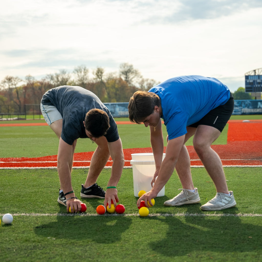 SMUSH BALLS stress balls on a sports field during play.