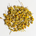Organic chamomile herbal tea dried flower blend in a loose pile