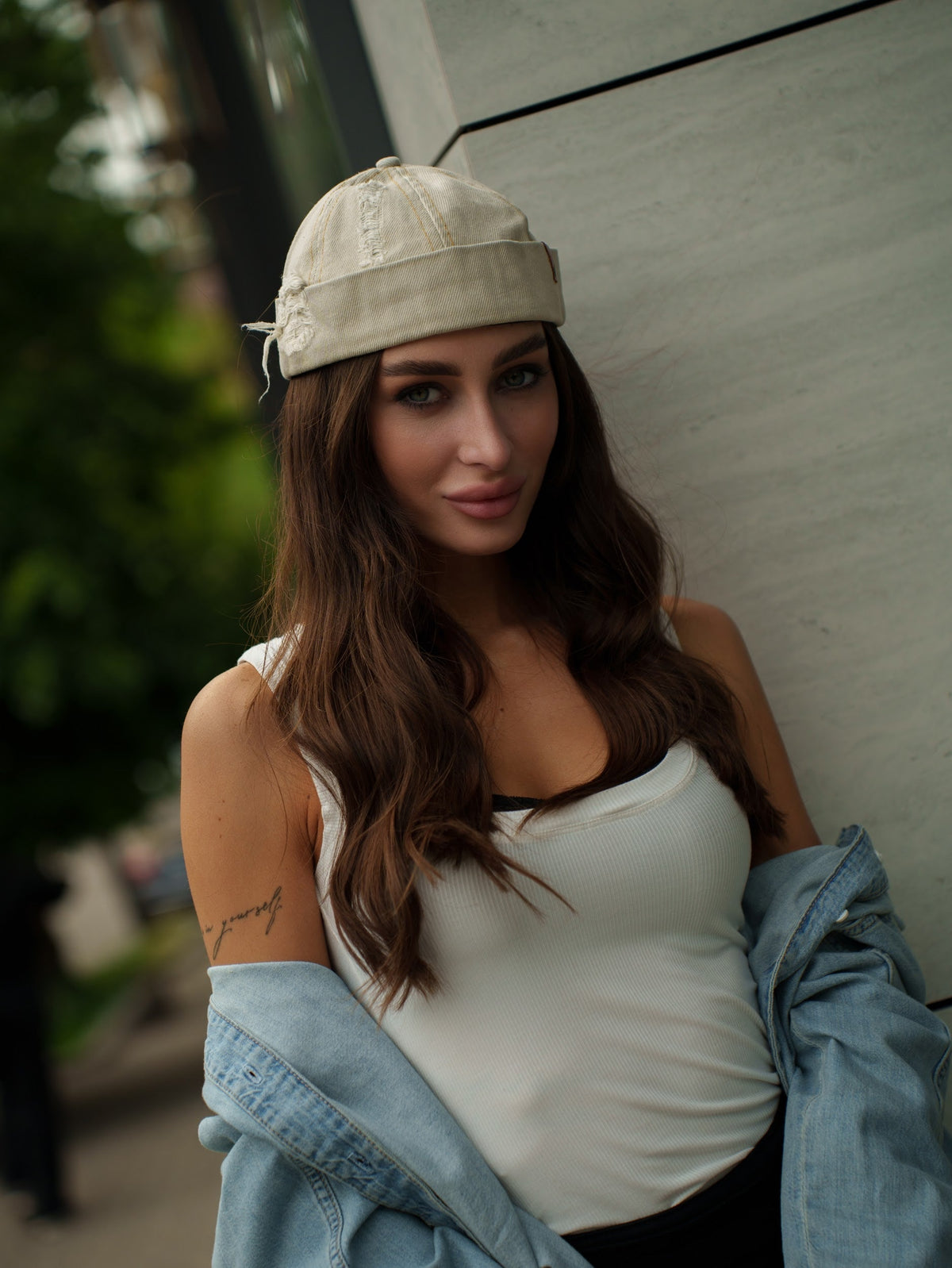 Beige canvas Docker-style cap with side panel distress and curved brim