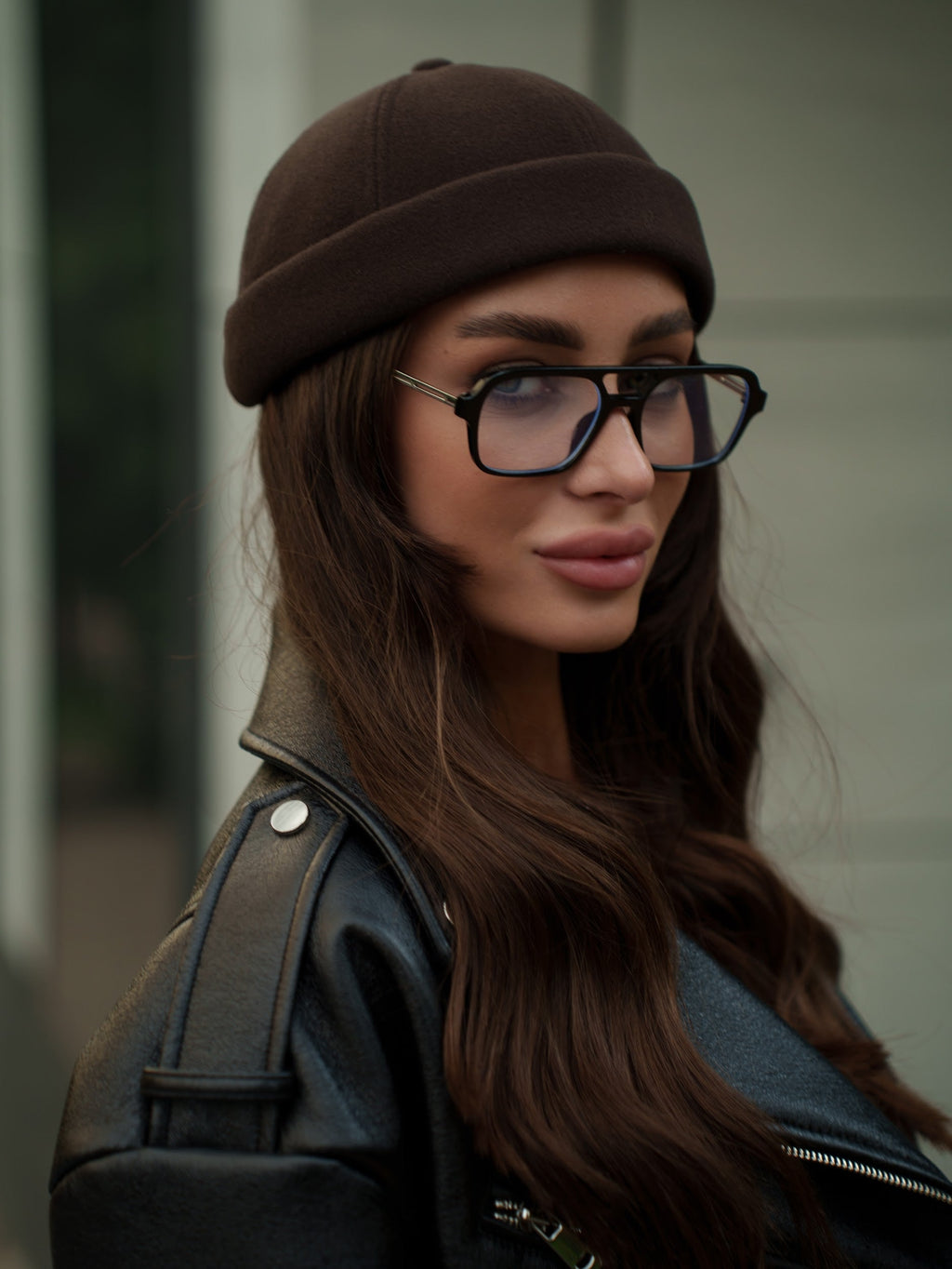Chocolate-brown Docker cap on model, front three-quarter view of crown
