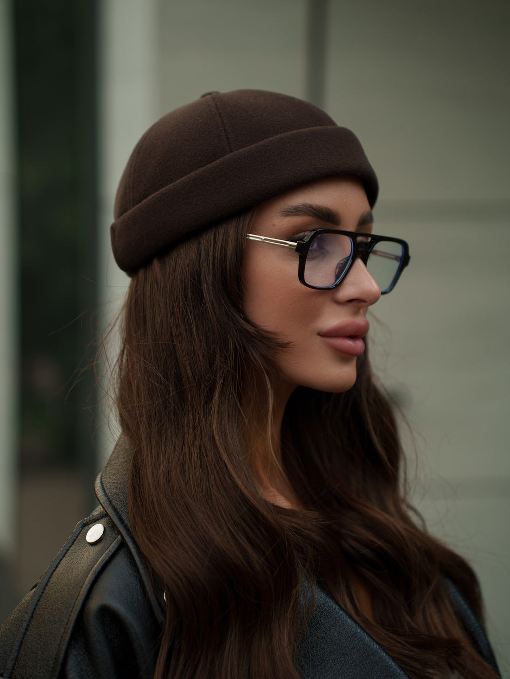 Chocolate-brown Docker cap on model, side profile of rounded crown