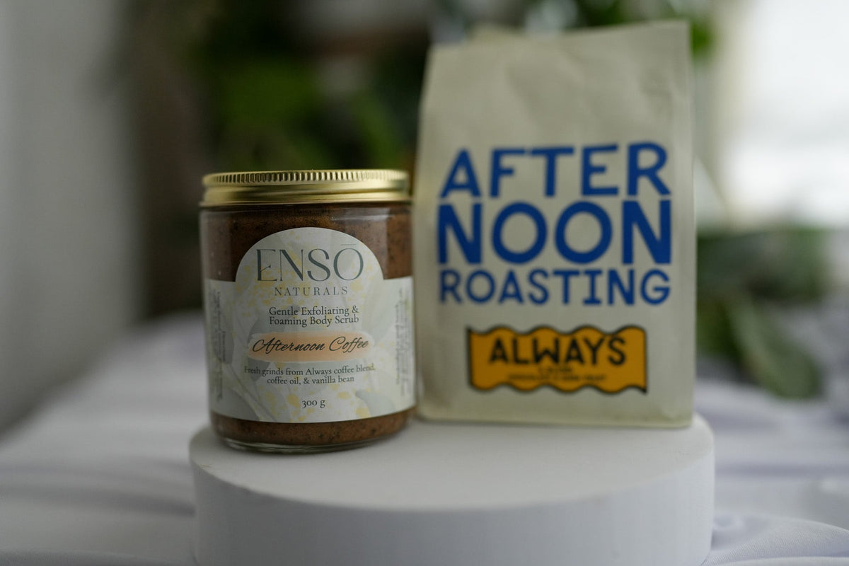 Gentle foaming sugar scrub jar with gold lid next to an After Noon Roasting pouch